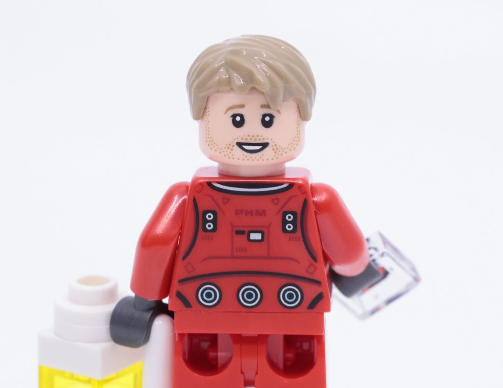 Зворотний бік мініфігурки LEGO Райленда Грейса